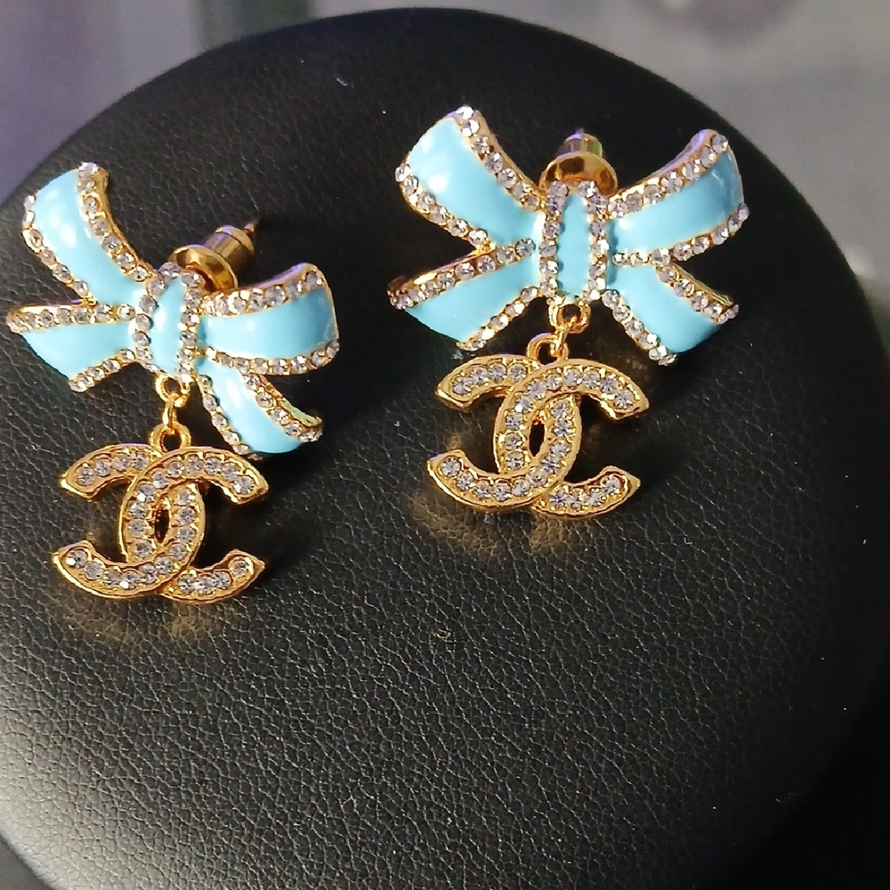 Elegant Blue Bow Earrings with Gold Accents